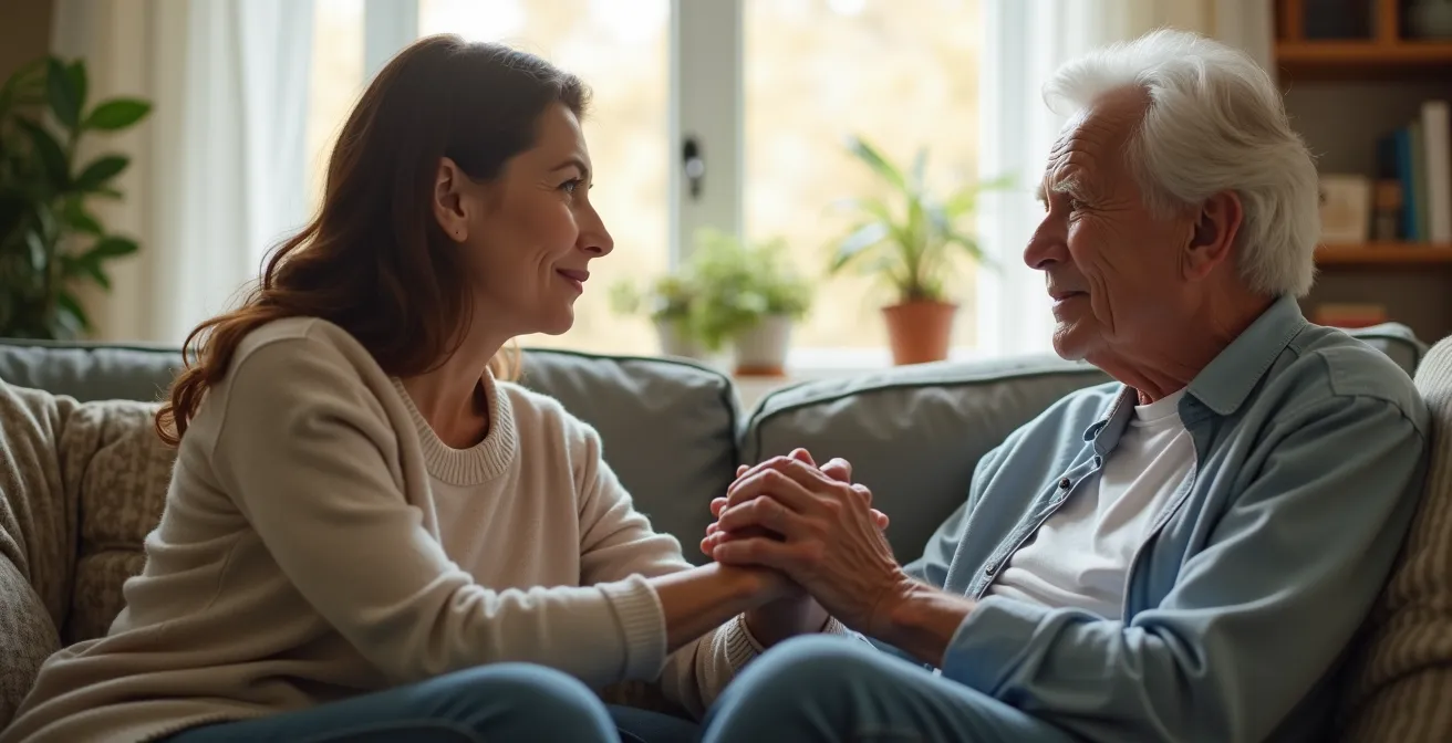 Discussion bienveillante entre enfant adulte et parent âgé dans un salon chaleureux